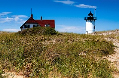 Race Point Light By Beach Grass on Cape Cod in Massachusetts